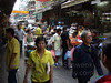 A very bustling shopping area in Chinatown.  Yellow shirts are worn on Mondays to honor the king of Thailand.